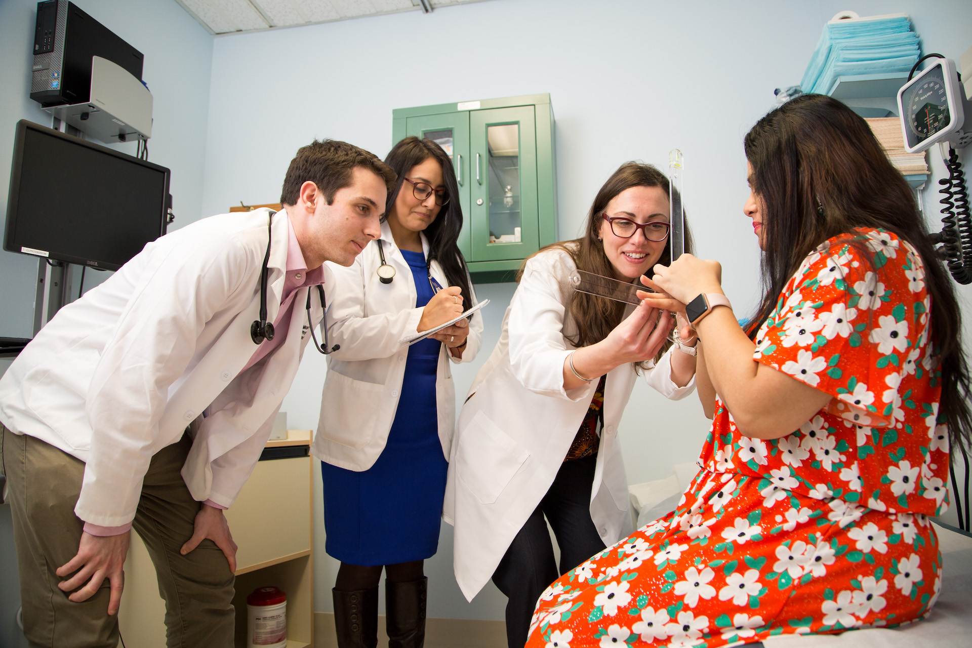 Image of doctors assisting a patient